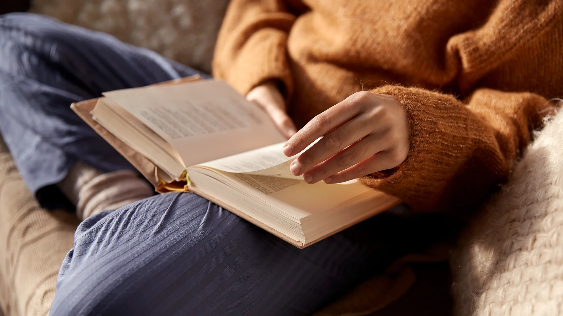 Woman reading a personal growth book focused on women’s empowerment, self-worth, confidence, and mindset transformation.